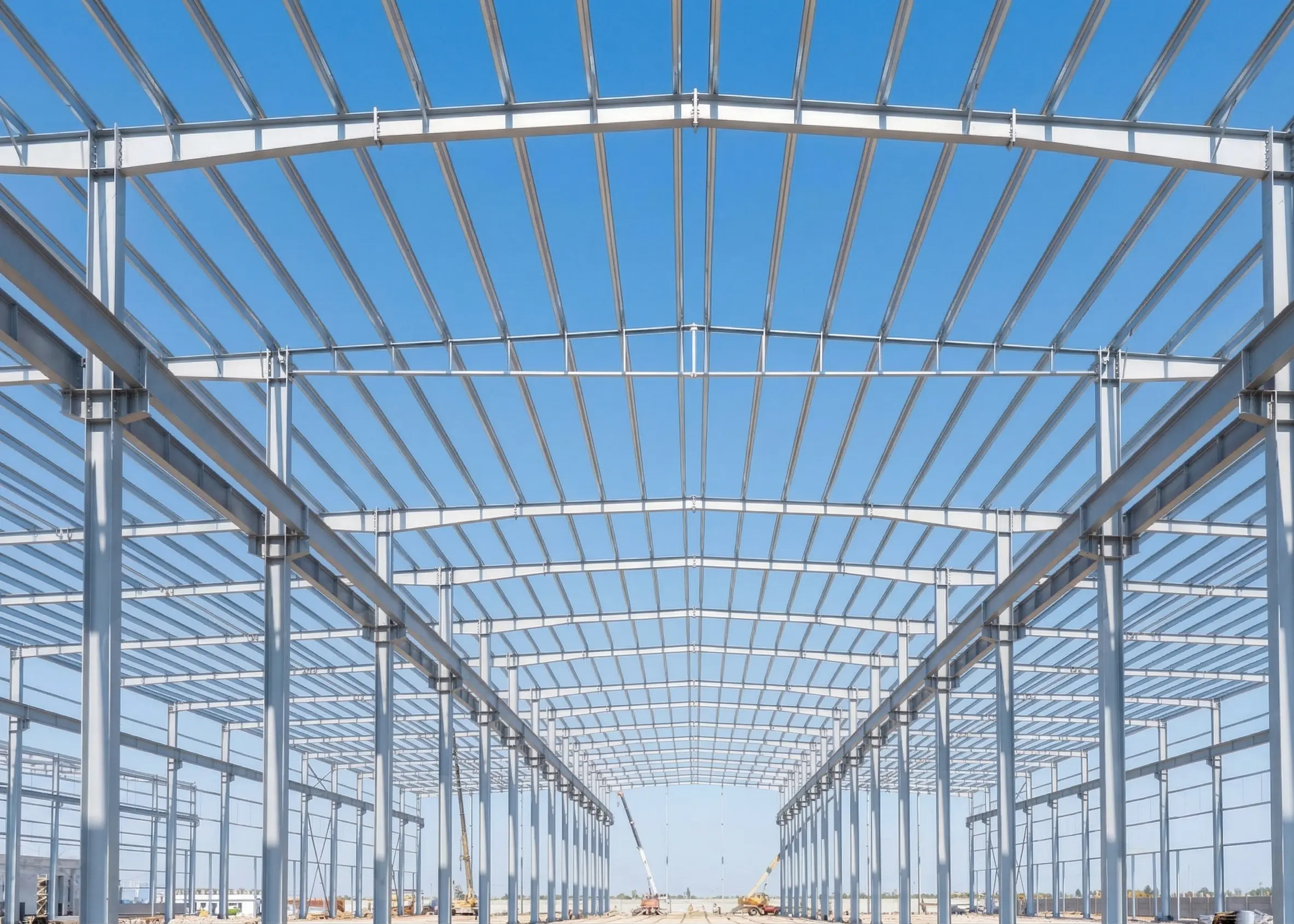 Pre-engineered building steel structure under construction for industrial warehouse project.